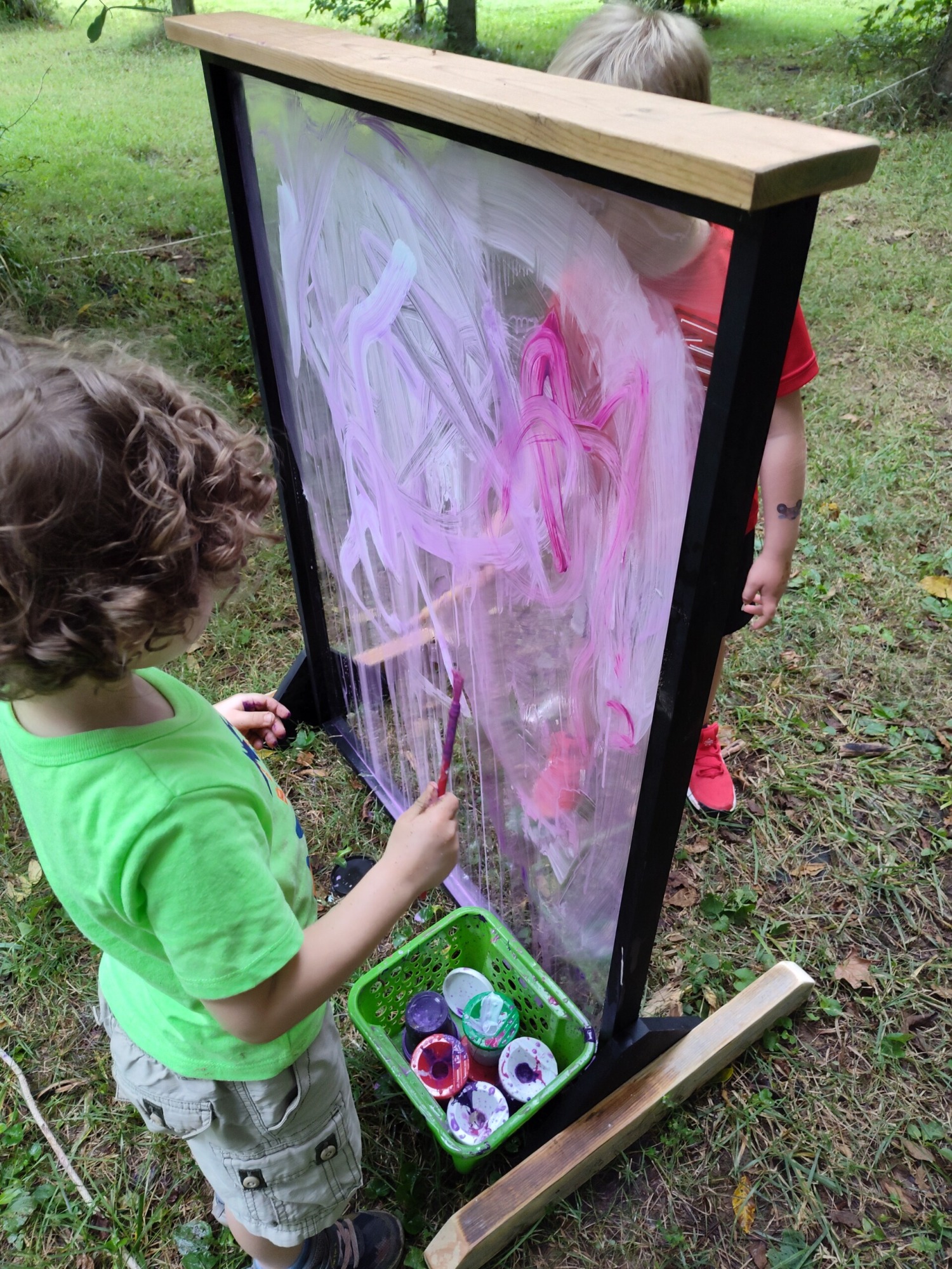 boy painting on the canvas
