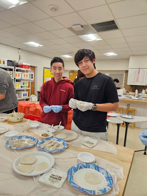 Students at Jericho High School making dumplings during Chinese New Year celebration