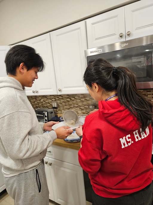 Jericho High School Chinese language students participating in traditional dumpling-making activity